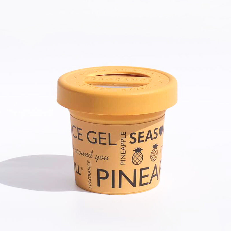 Gourmet Aroma car air freshener in Pineapple scent. A long-lasting solid gel that eliminates vehicle odors with a sweet, tropical fragrance.