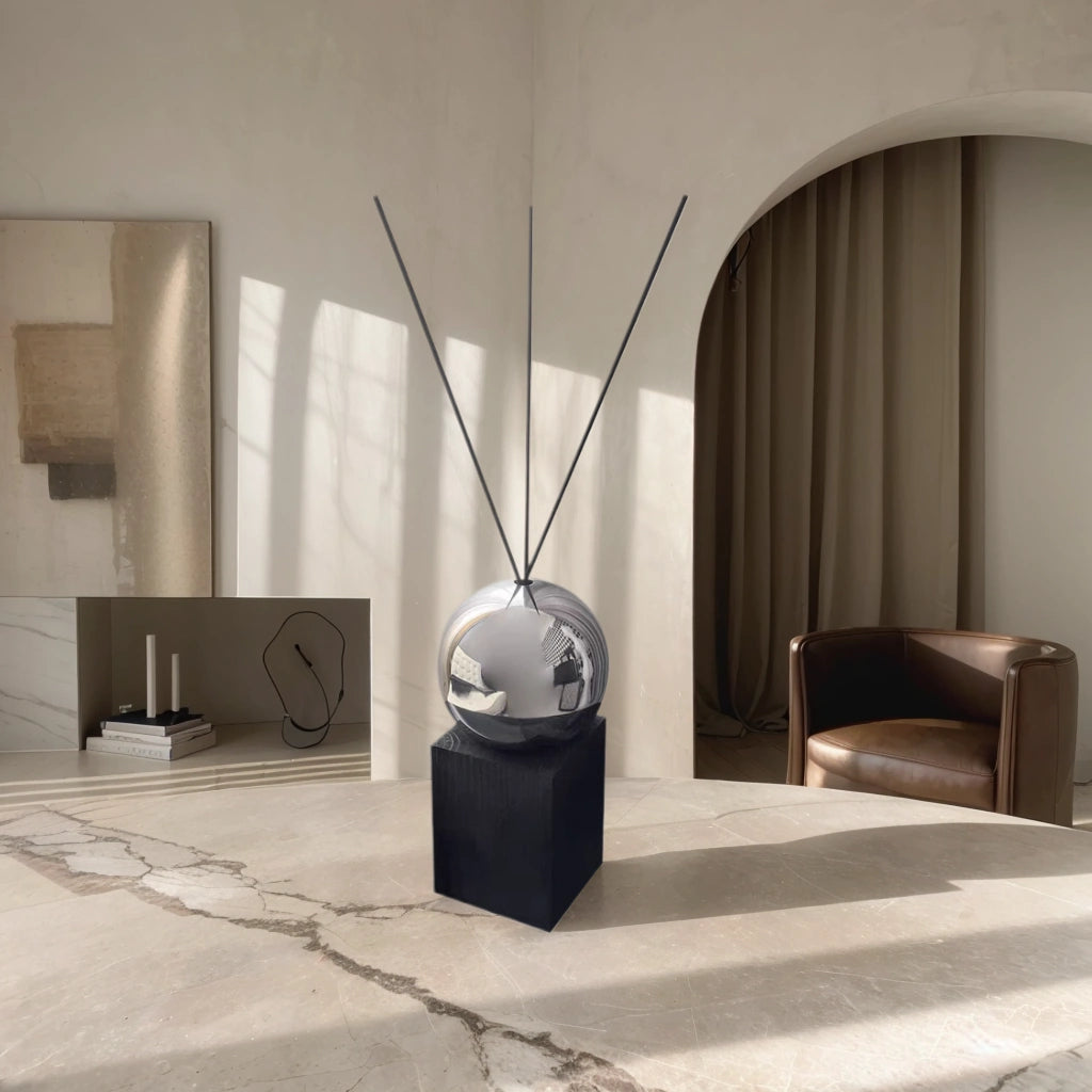 Sleek black diffuser as a decorative centerpiece on a modern living room side table