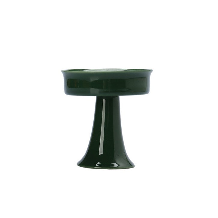 Green ceramic candle holder for tealight candles. A decorative piece ideal for creating a table centerpiece.