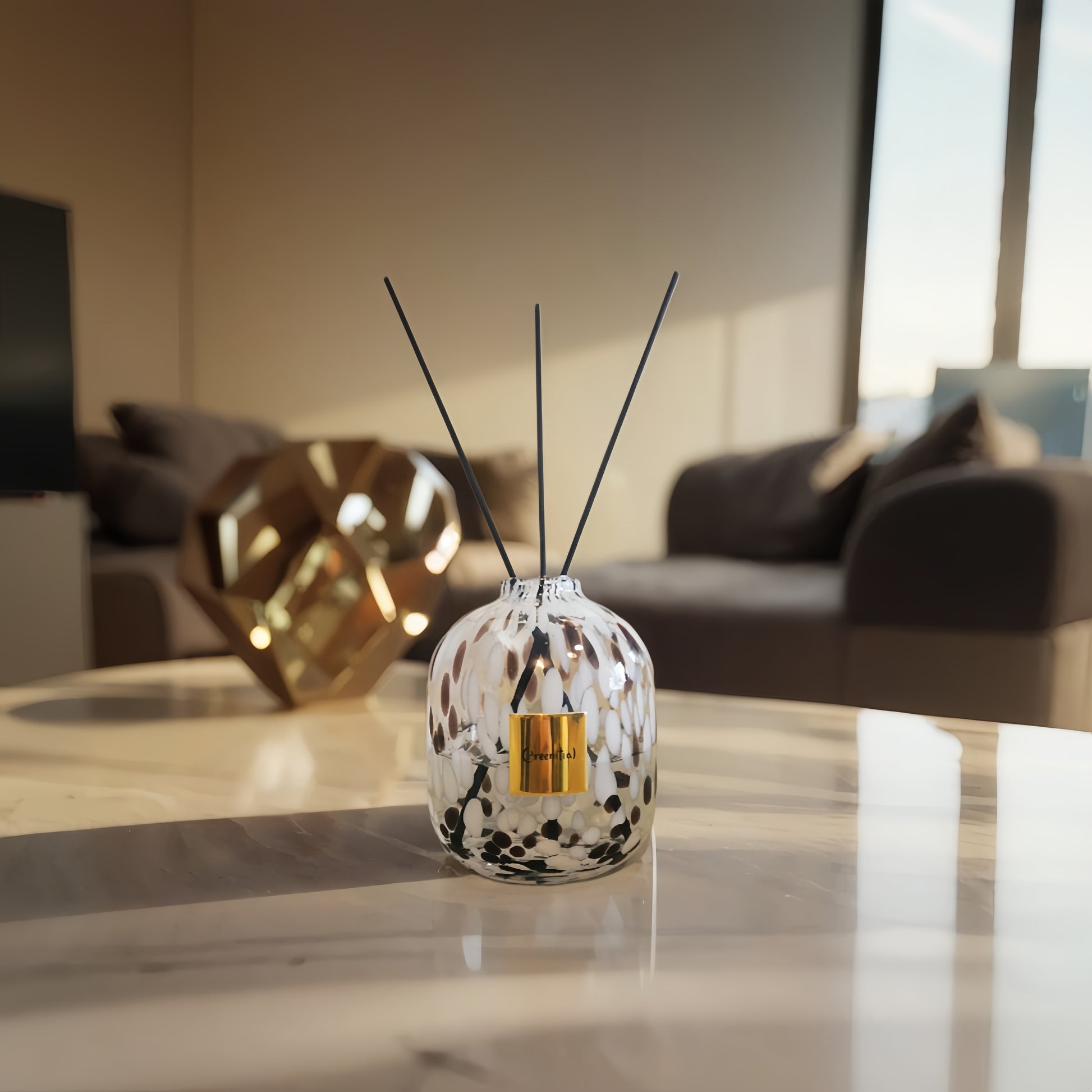 A stylish white leopard-print glass bottle for reed diffusers by Greenitial, showcased on a clean marble surface for home decor.