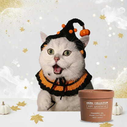 A cat wearing the classic orange and black Halloween costume set next to our natural pet odor eliminator, showcasing the perfect holiday bundle.