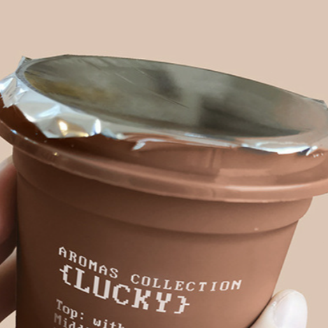 Close-up of the seal on the air freshening gel container, ensuring the gel remains potent and the fragrance is preserved until first use.