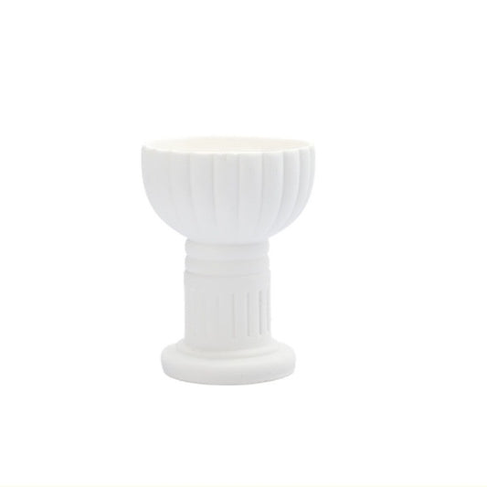 White ceramic candle cup with vertical striped design, for holding tealights or votive candles.