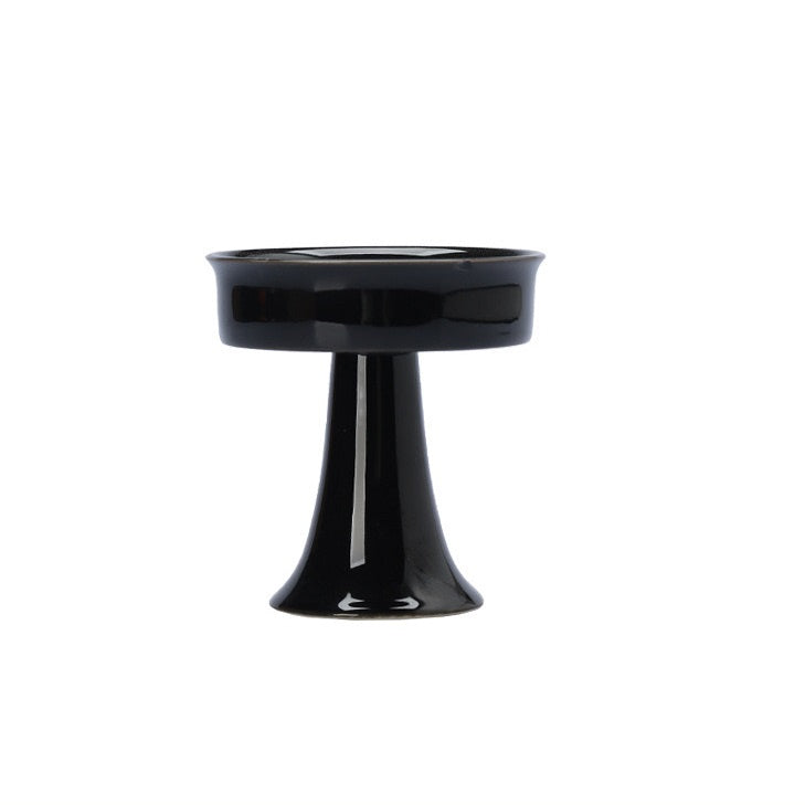 Black ceramic candle holder for tealight candles. A decorative piece ideal for creating a table centerpiece.