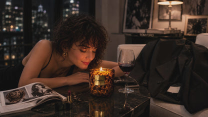 A warm cinematic fragrance film capturing the soft wild side of modern femininity — where leopard textures, candlelight, jazz ambiance, and quiet luxury transform an ordinary city night into a sensual self-care ritual.