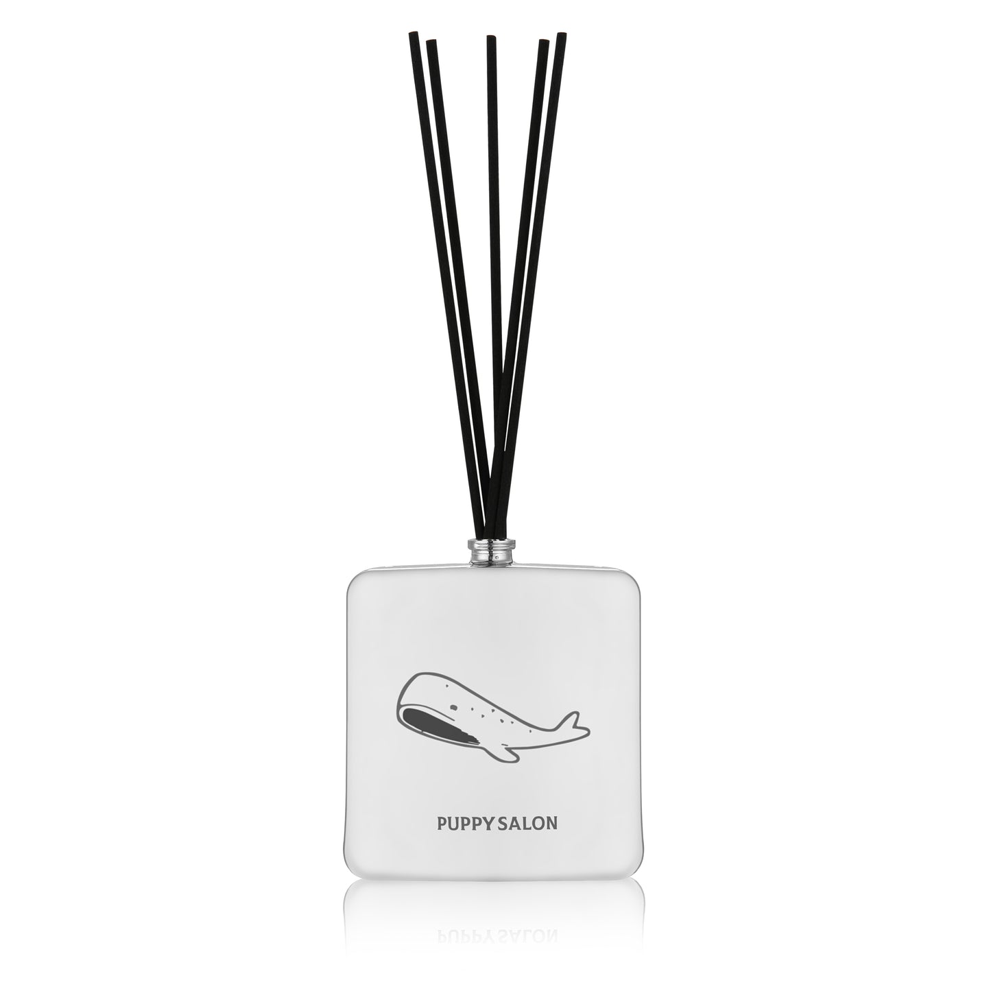 Isolated view of the Puppy Salon '52 Hertz' reed diffuser. The sleek silver glass bottle with abstract cut-outs creates a mysterious, modern ambiance.