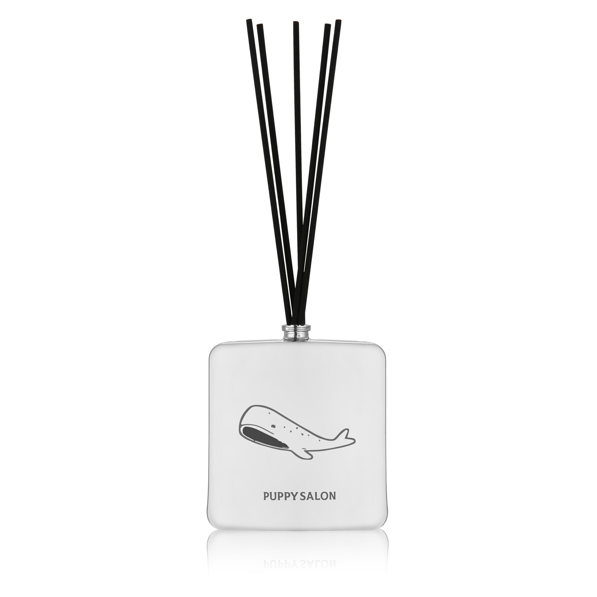 Isolated view of the Puppy Salon '52 Hertz' reed diffuser. The sleek silver glass bottle with abstract cut-outs creates a mysterious, modern ambiance.