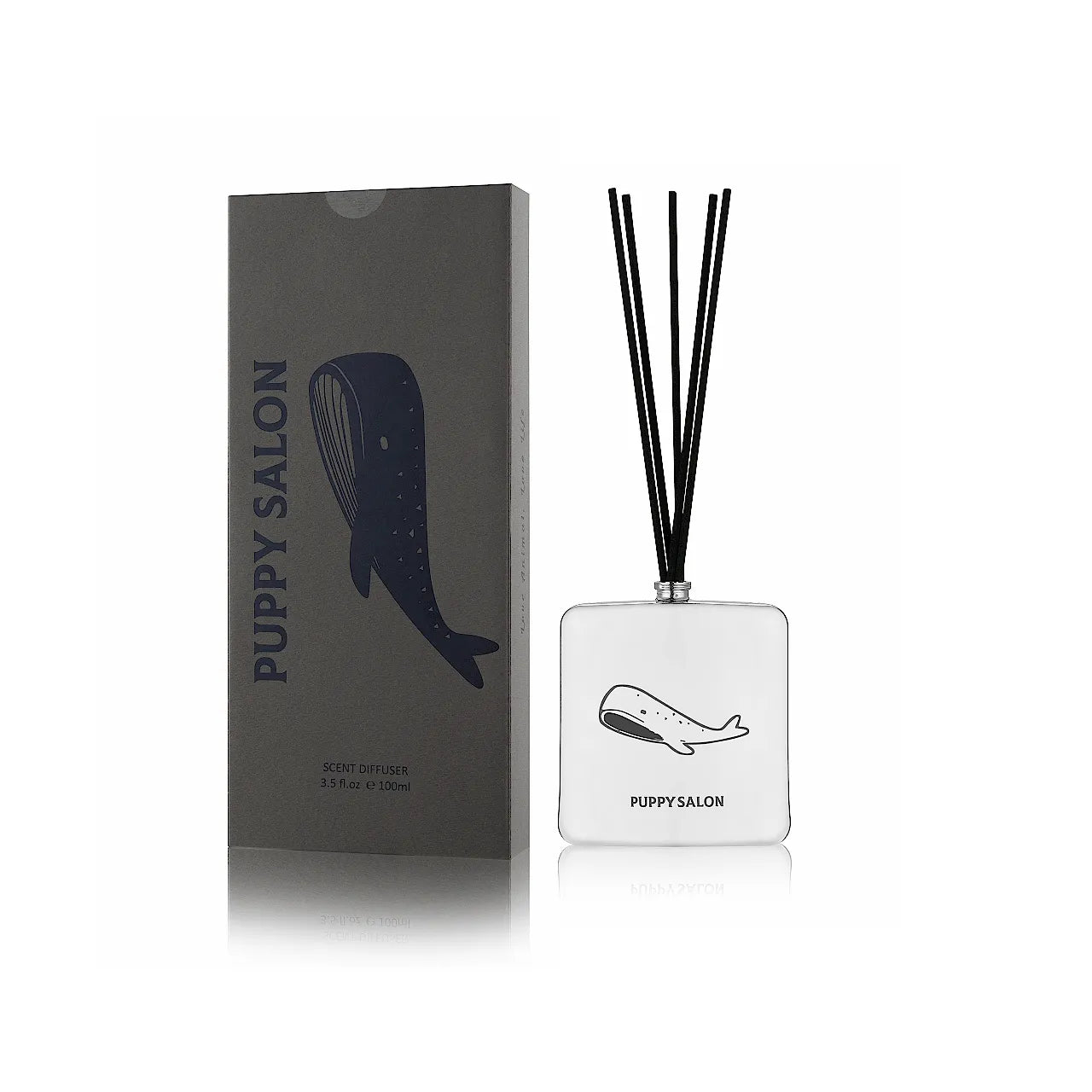 The Puppy Salon '52 Hertz' reed diffuser with its modern grey gift box. The silver cut-out glass vessel is designed for contemporary spaces.