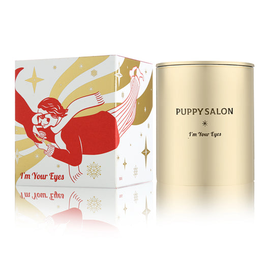 The 'I am your eyes' candle by Puppy Salon with its gift box. Features a gold cut-out glass jar.