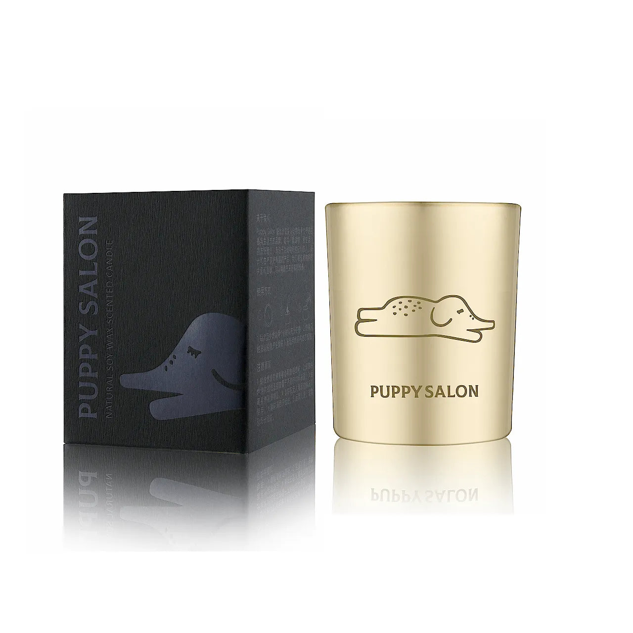 The 'An Elephant Never Forgets' candle by Puppy Salon with its gift box. Features a gold cut-out glass jar with elephant designs.
