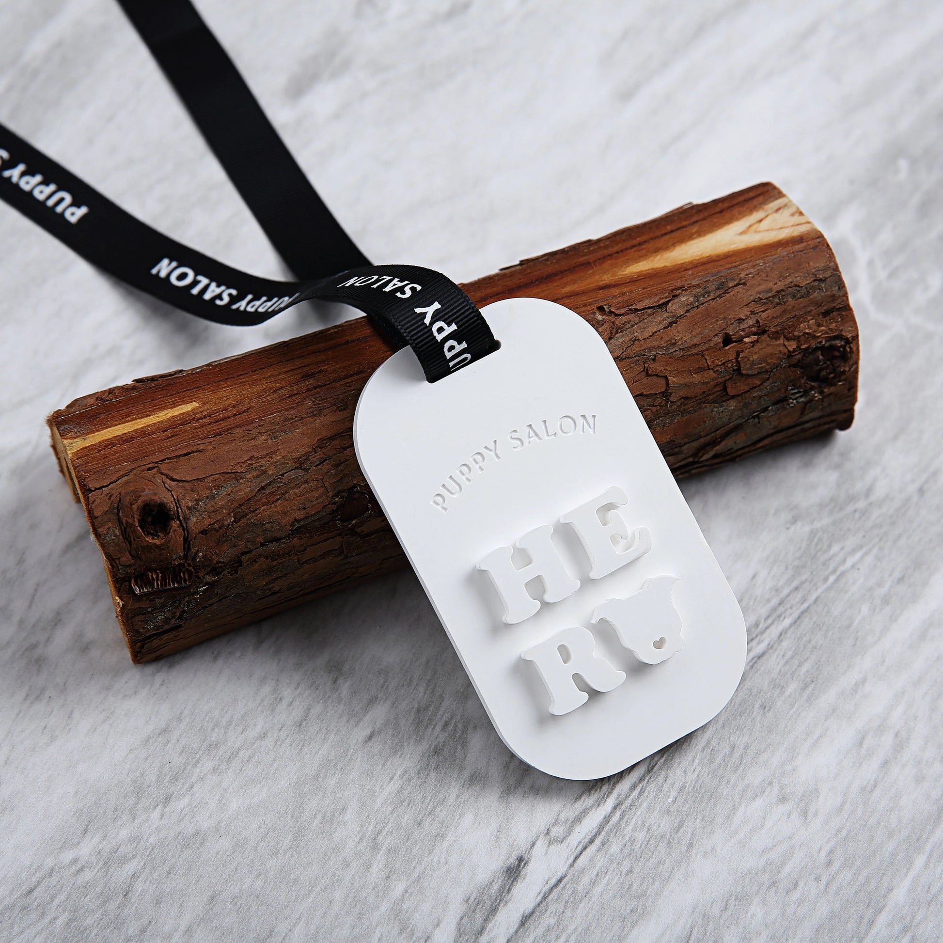 Puppy Salon scent tablets arranged elegantly on a marble surface, demonstrating their use as a stylish decor item while freshening the air.