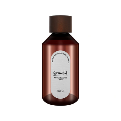 Bottle of Cinnamon & Brandy reed diffuser refill oil. Long-lasting fragrance for refreshing your home.