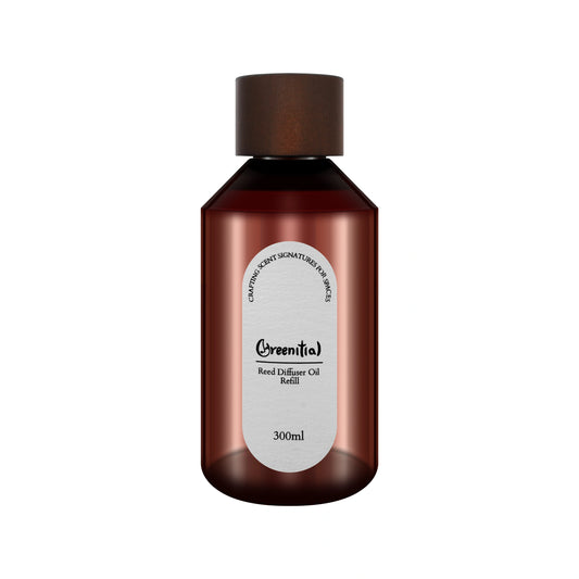 Bottle of Cinnamon & Brandy reed diffuser refill oil. Long-lasting fragrance for refreshing your home.